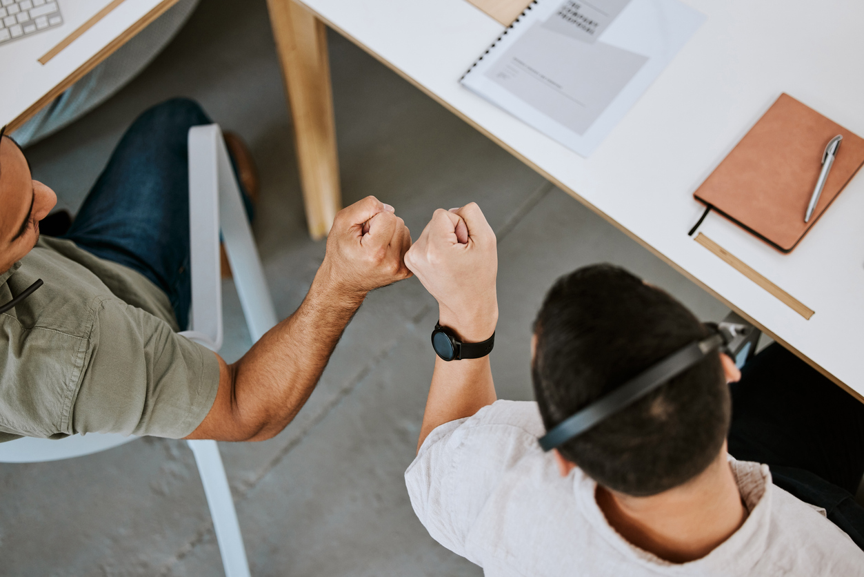 two men fist bump in an office, celebrating a success. The Valley List is happy to offer white label agency support services in Wheeling, and be a part of your team.