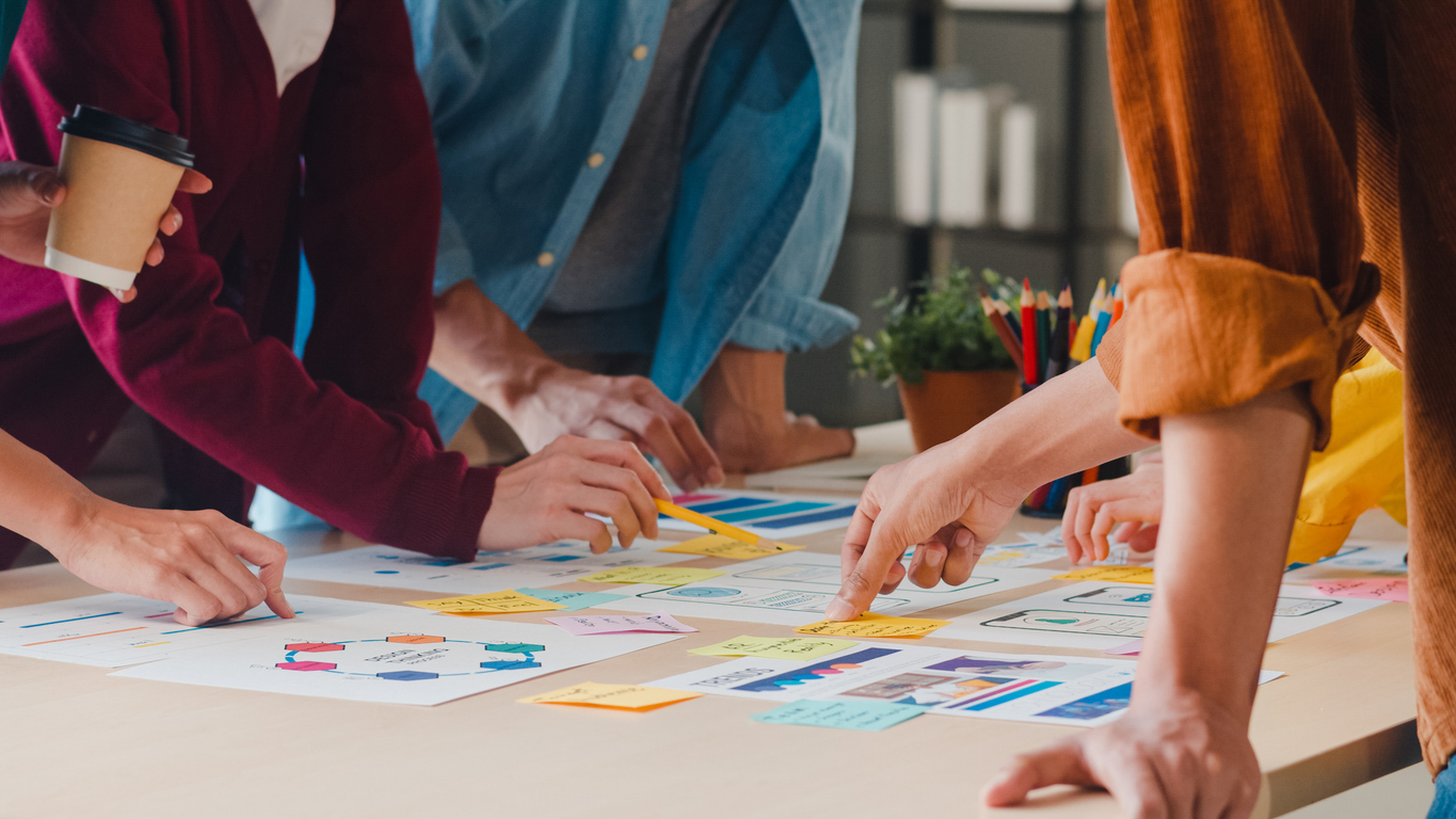 A group of people work on building an app. What is cross platform app development?