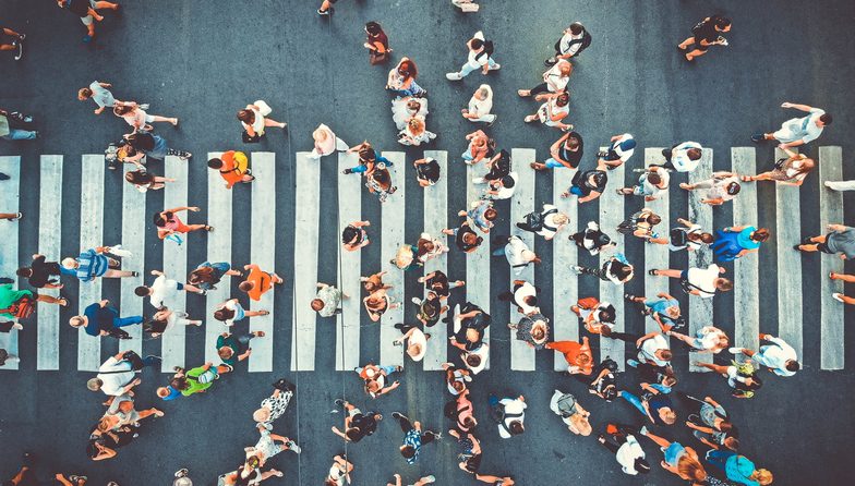 A group of people walk across the road, going to businesses. The Valley List is a SEO Company in Dublin, Ohio.