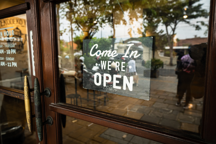 A up-close photo of the glass door of a shop, the sign says "come in, we're open". The Valley List is here to handle your website maintenance in Dublin, Ohio.