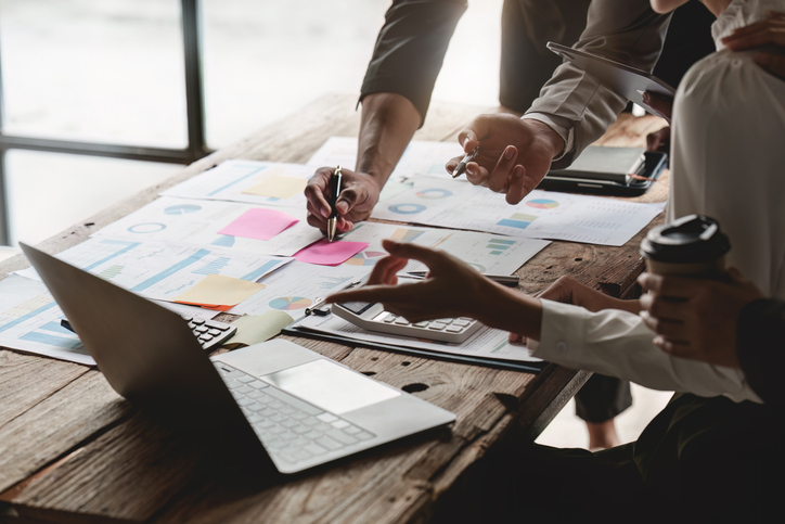 Two people develop UX and UI wireframes, with a laptop beside them. The Valley List provides services for website development in Westerville, Ohio.
