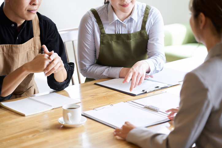 Three folks sit around a table, their faces are not visible. They each have a notepad, and are working on digital marketing strategies. The Valley List, together with Web Impact Marketing, is proud to serve as a digital marketing agency in Worthington, Ohio.