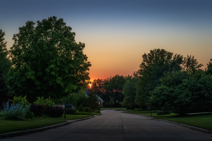 The sun sets over some trees in a residential area in the Midwest. The Valley List is a trusted website design company in Westerville, Ohio.