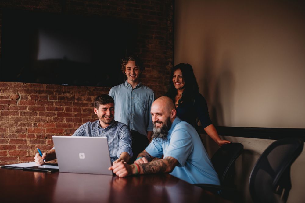 The Valley List team discussing a web design project in the Marietta, Ohio office. Learn all about us as your trusted website partner.
